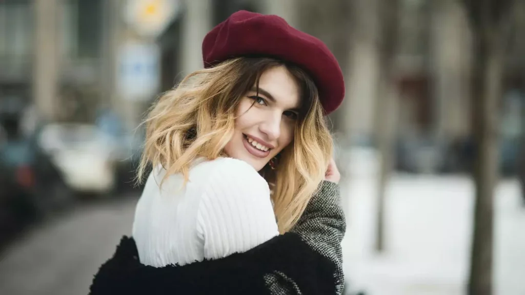 a woman wearing a red beret